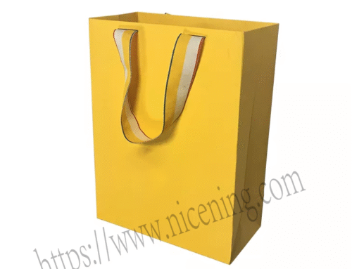 Printing logo Blank yellow kraft paper tote bag thickened clothing packaging shopping bag with printing logo and colored ribbon.www.nicening.com