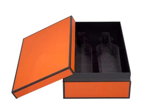 Orange two-piece paperboard wine gift box with inner collar and printed black edges